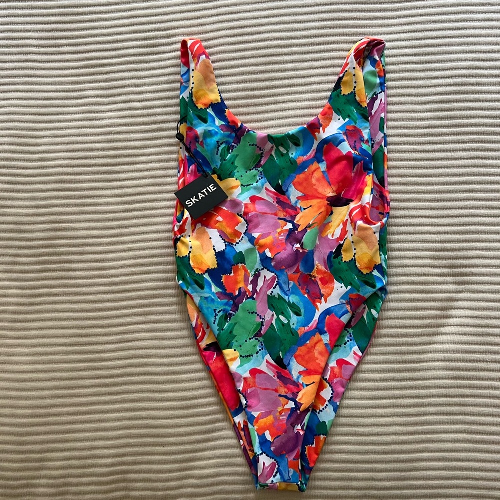 Skatie Swim one piece deep neck high rise minimal backside low scoop back